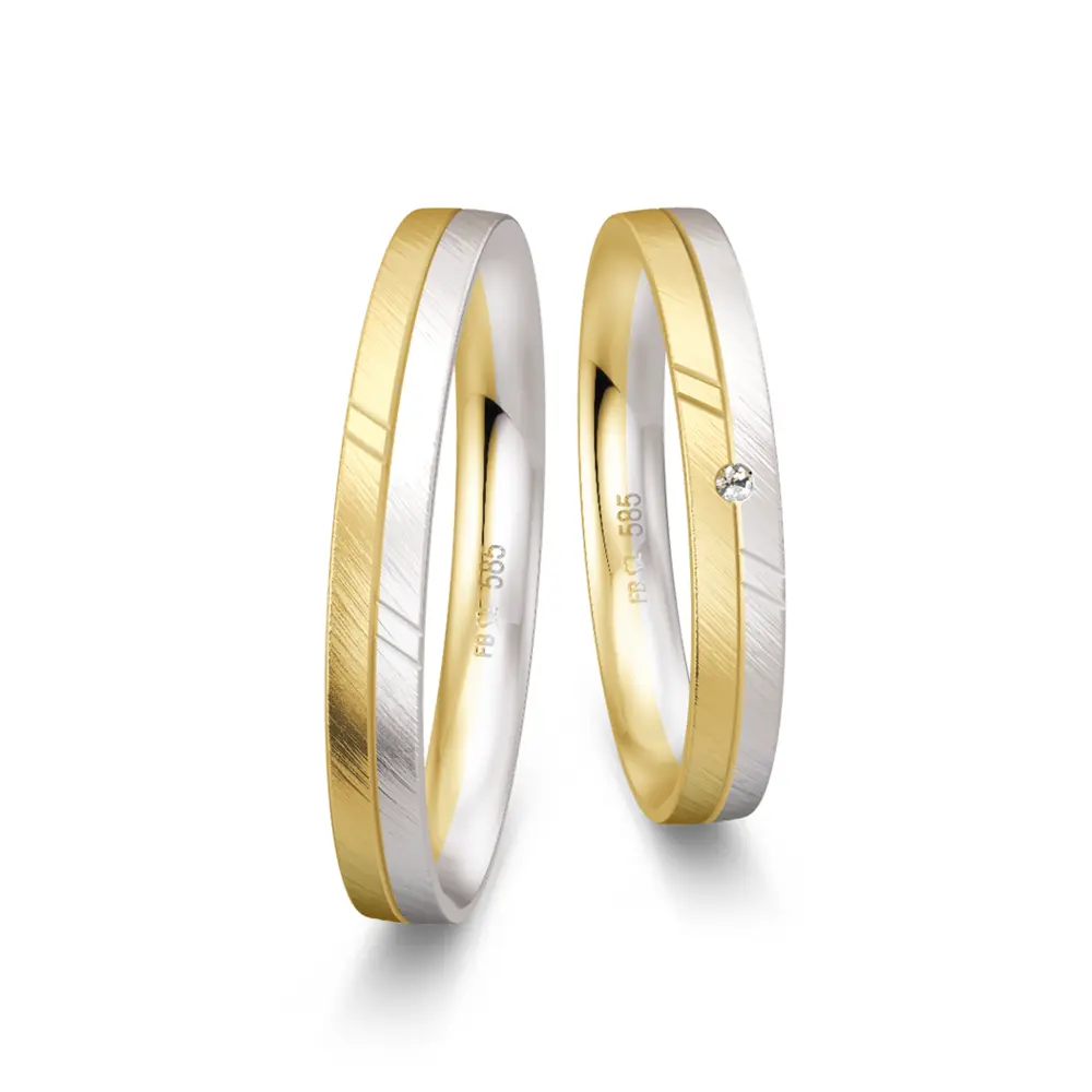 Trauringe aus Gelbgold und Weißgold schmal quermatt mit Diamant