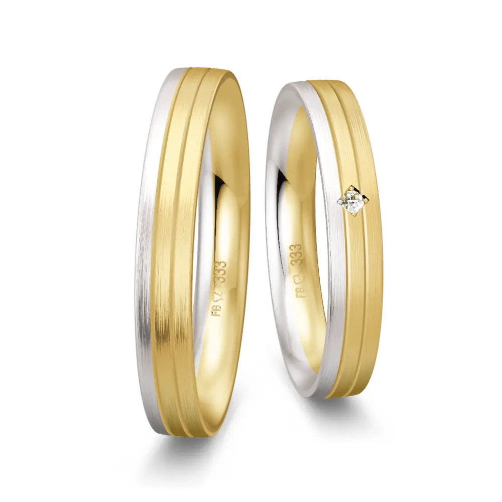 Trauringe aus Gelbgold und Weißgold schmal längsmatt mit Diamant