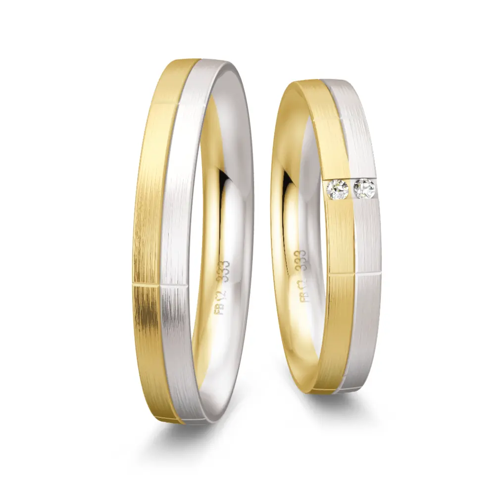 Trauringe aus Gelbgold und Weißgold mattiert mit 2 Diamanten und Rillen
