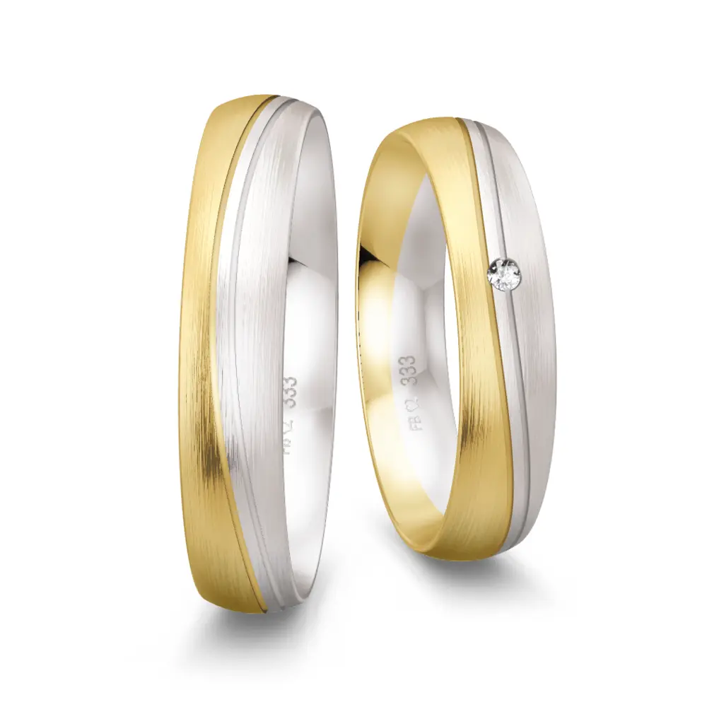 Eheringe aus Gelbgold und Weißgold matt gerundet mit 2 Rillen und Diamant