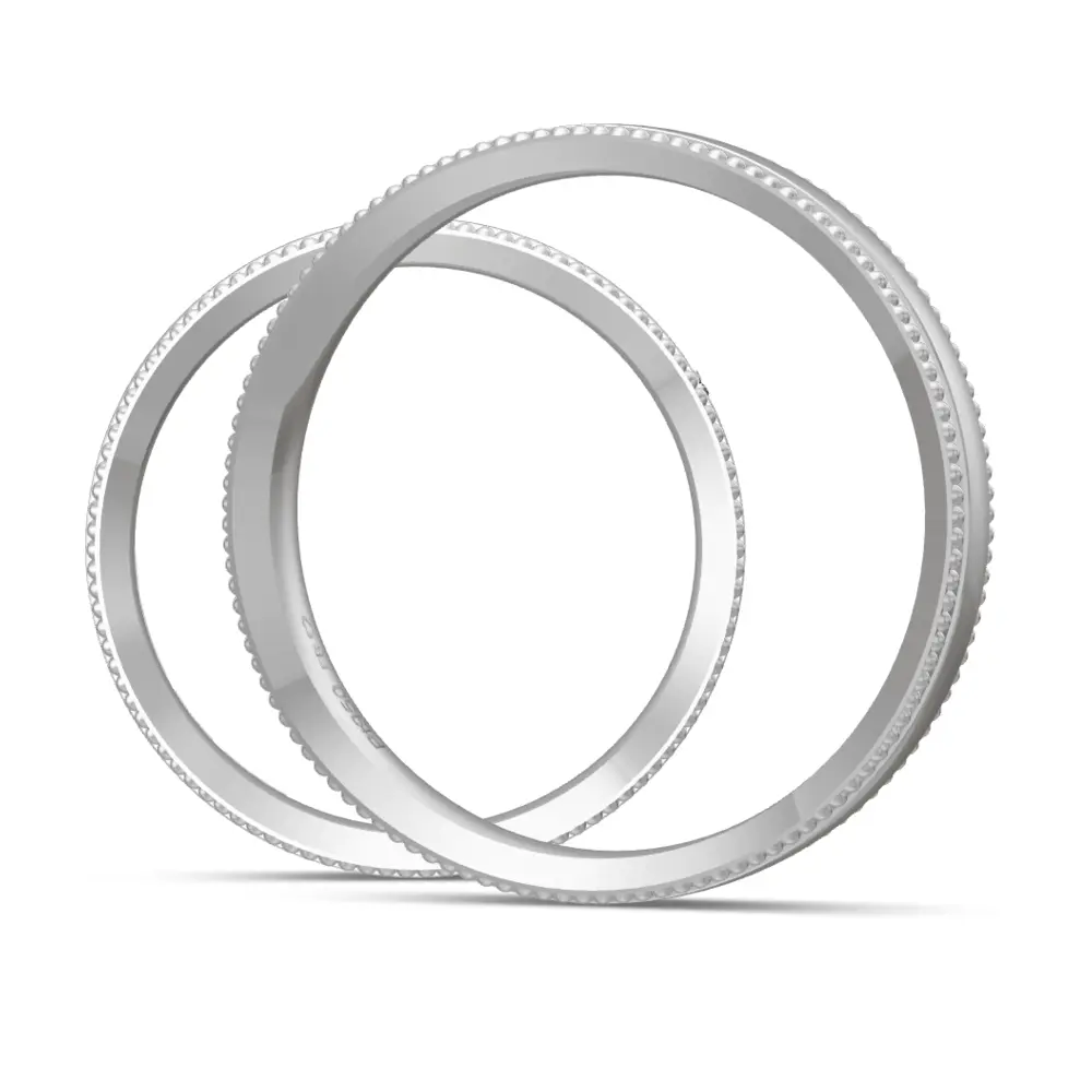 Eheringe aus Platin poliert mit Diamanten und Millgriffmuster am Rand seitlich