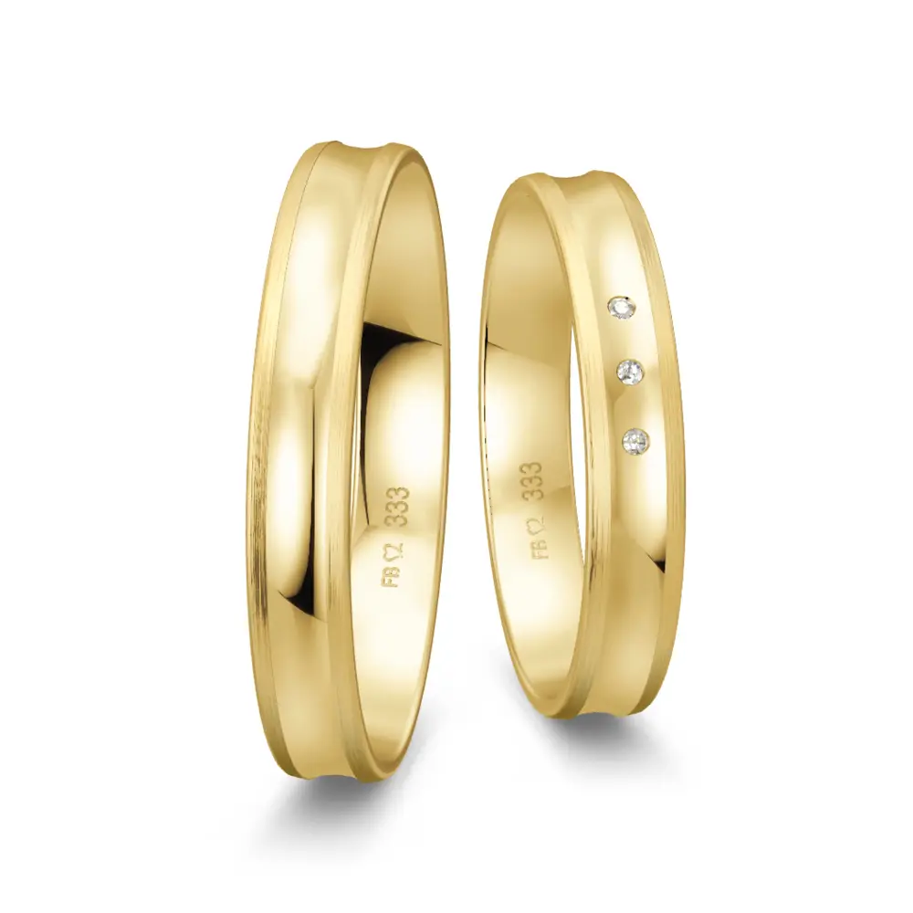 Trauringe aus Gelbgold poliert mit konkaver Form mit drei Diamanten