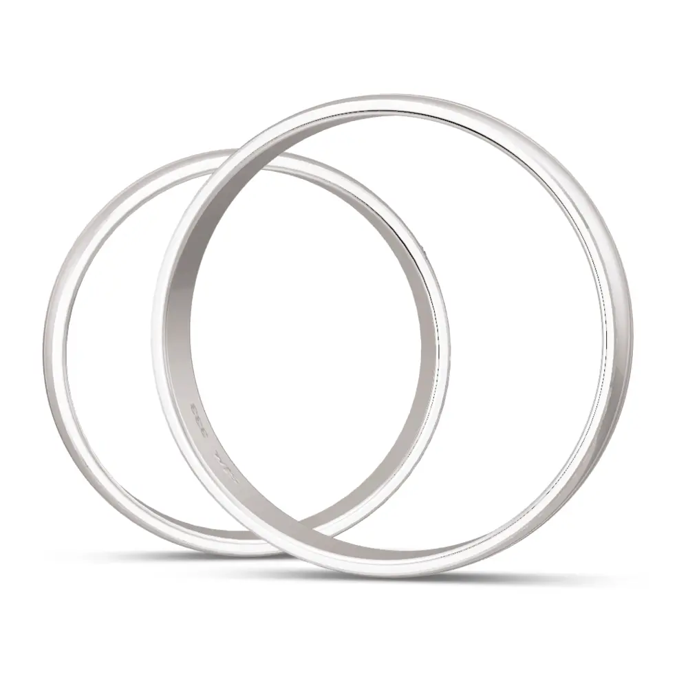 Weissgold Trauringe mit Diamant und welligem Rillenmuster seitlich