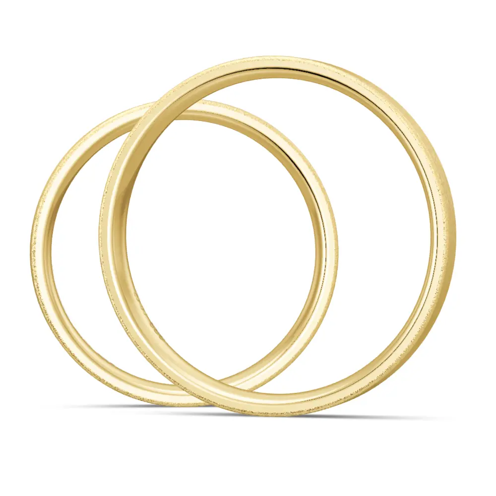 Sandmattierte Eheringe aus Gelbgold mit Diamanten in ovaler Vertiefung seitlich