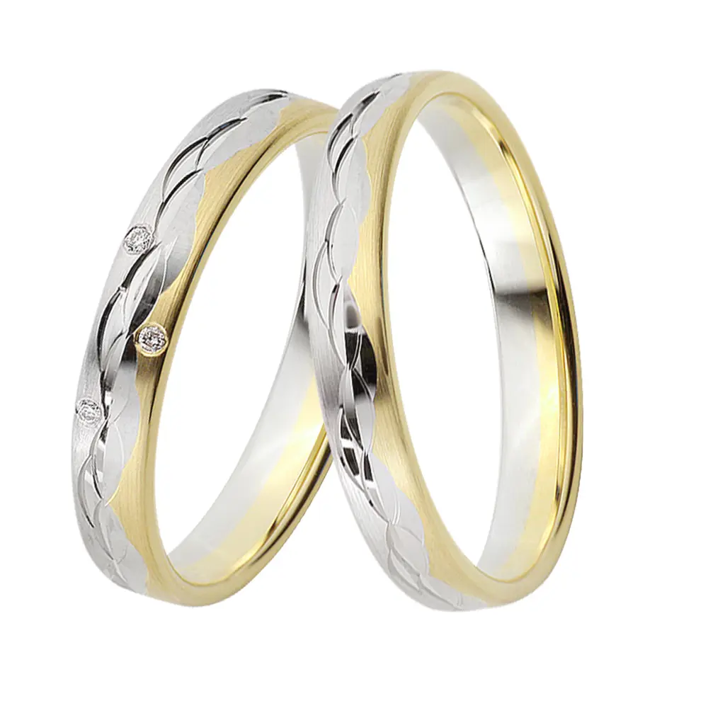 Gelbgold und Weissgold Eheringen mit Muster aus polierten Halbmonden und Diamant