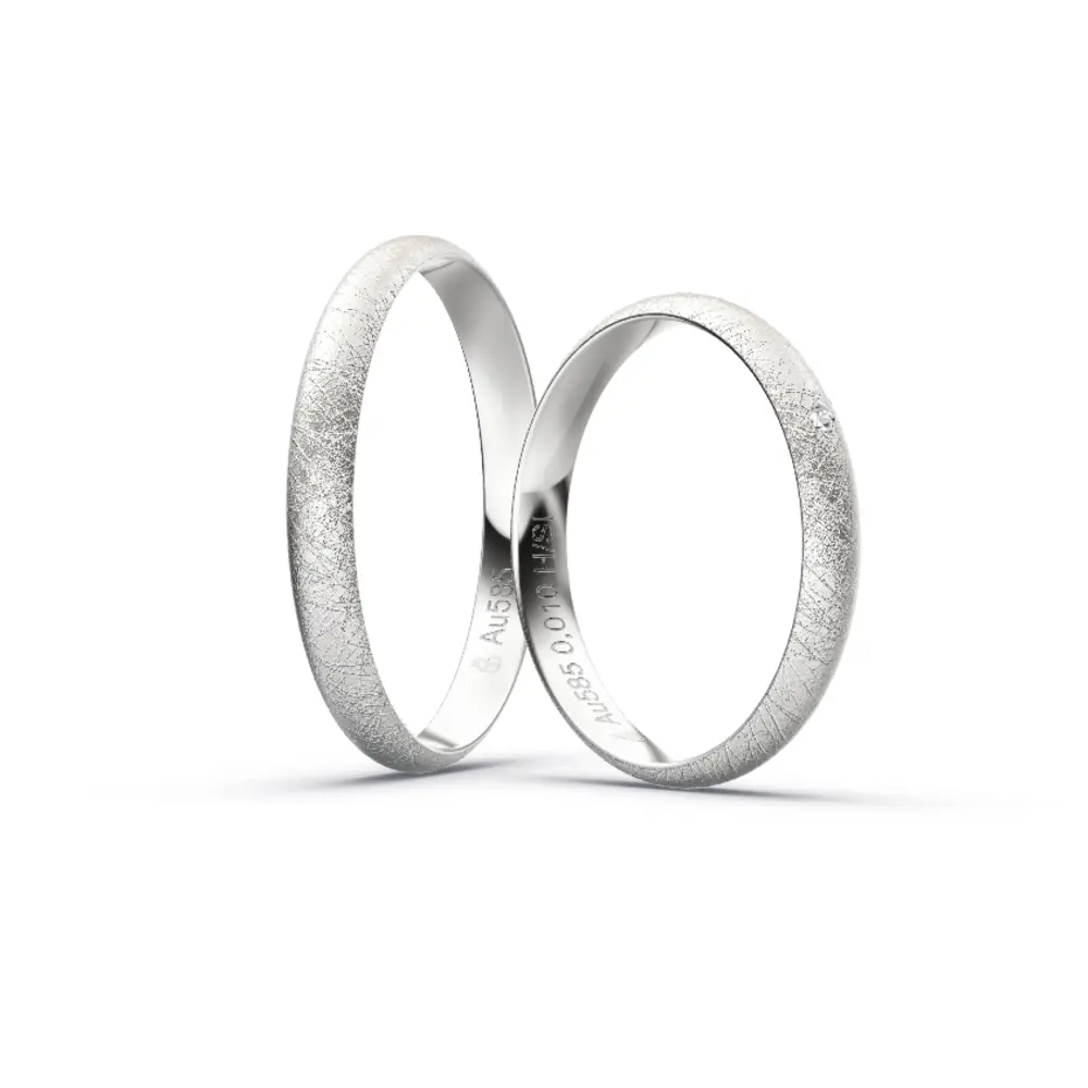 Aufnahme von schlichten eismatten Trauringen aus Weissgold mit Diamant mit 3 mm Breite
