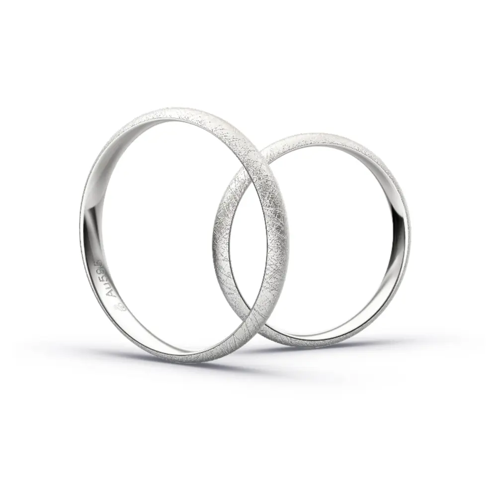 Aufnahme von schlichten eismatten Trauringen aus Weissgold mit Diamant mit 3 mm Breite