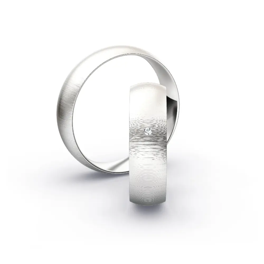 Aufnahme von Eheringen aus Weissgold mit Diamanten und Querbürstung in 6 mm Breite