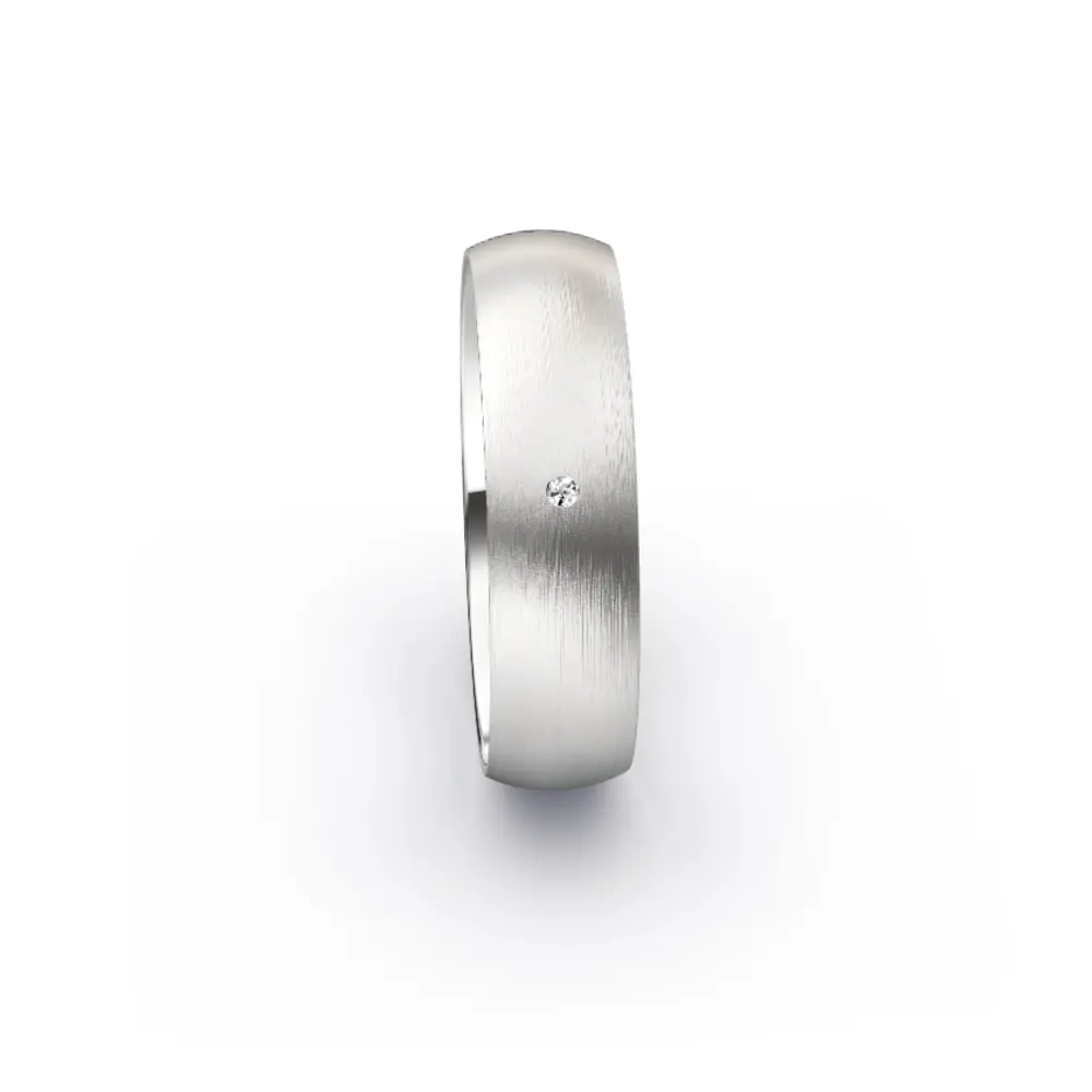 Aufnahme von schlichten matten Trauringen aus Weissgold mit Diamanten mit 6 mm Breite