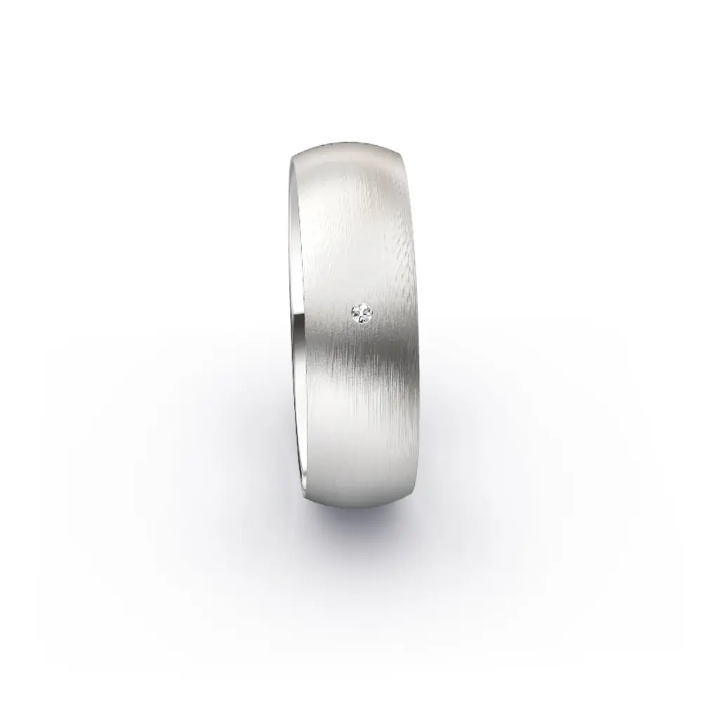 Aufnahme von seidenmatten Trauringen aus Weissgold mit weißem 0,01 Ct. Diamanten
