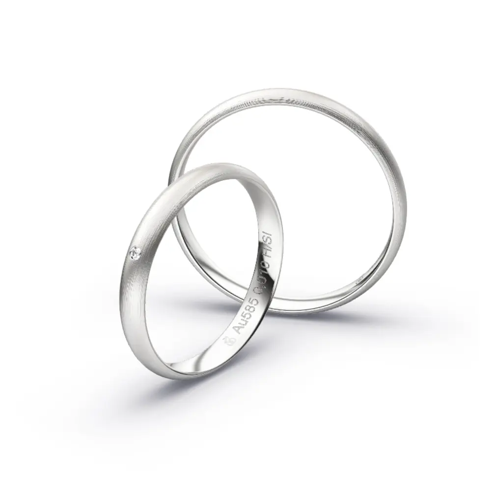 Aufnahme von schlichten matten Trauringen aus Weissgold mit Diamanten mit 3 mm Breite