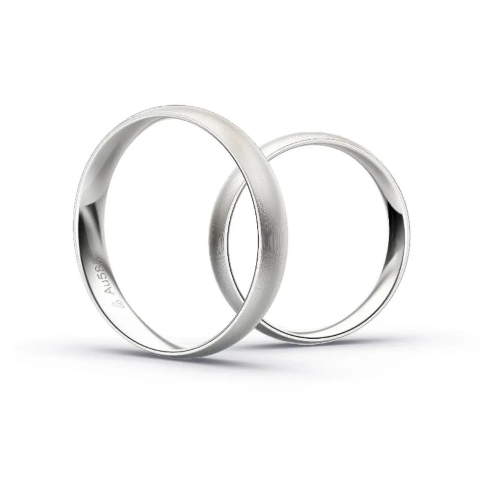Aufnahme von schlichten matten Trauringen aus Weissgold mit Diamanten mit 4 mm Breite