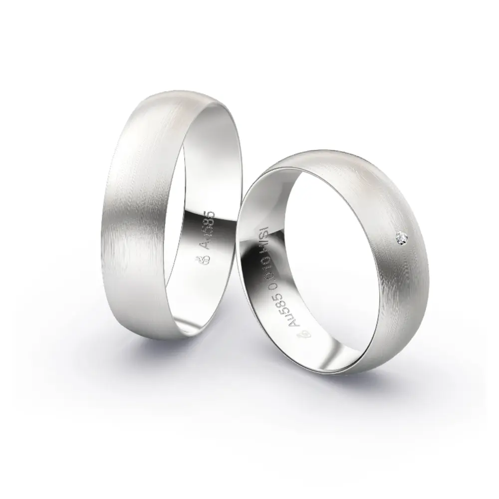 Aufnahme von schlichten matten Trauringen aus Weissgold mit Diamanten mit 6 mm Breite