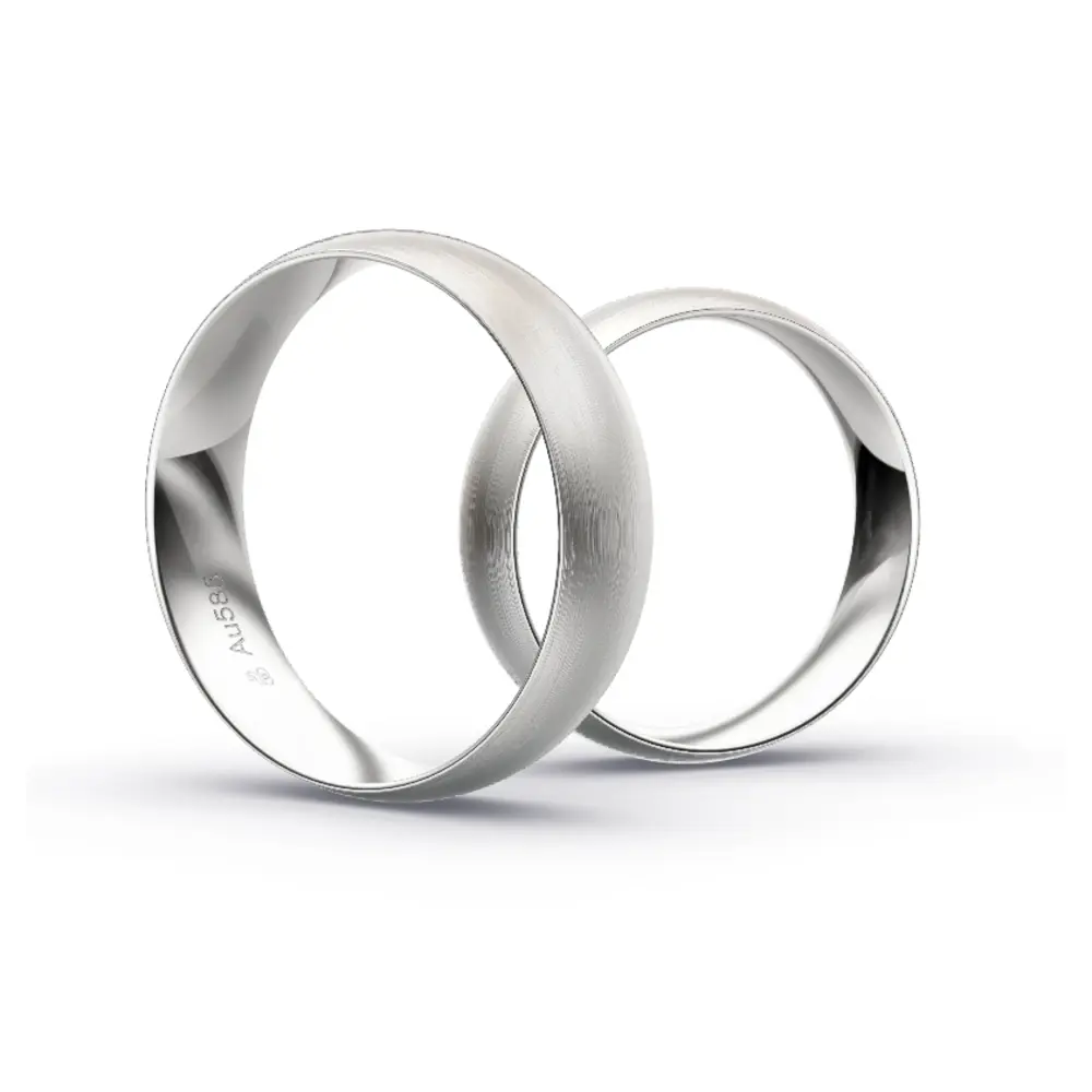 Aufnahme von schlichten matten Trauringen aus Weissgold mit Diamanten mit 6 mm Breite