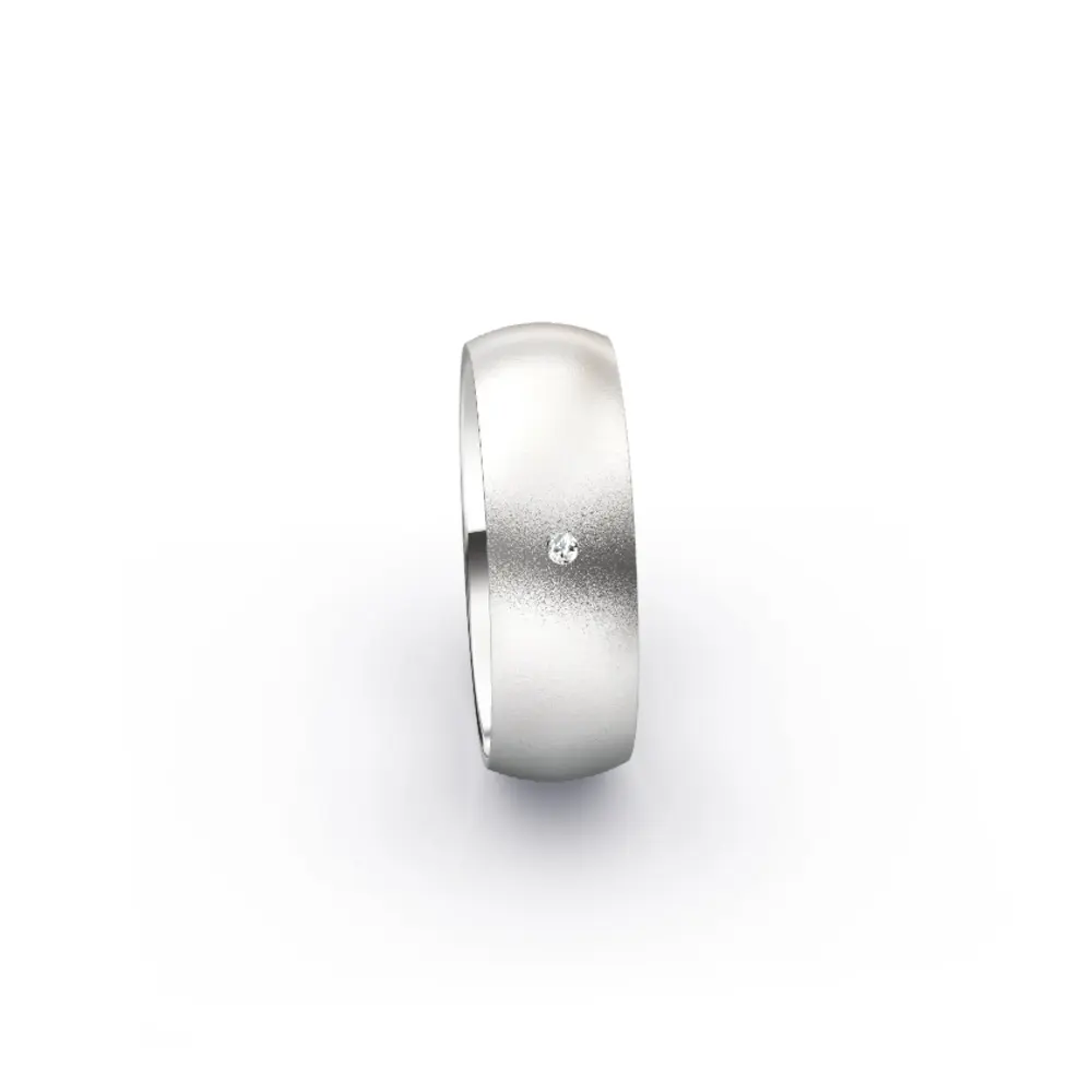 Aufnahme von schlichten sandmatten Trauringen aus Weissgold mit Diamanten mit 6 mm Breite