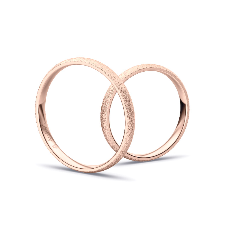 Aufnahme von Eheringen aus Roségold mit Körnung und Diamanten und 2,5 mm Breite