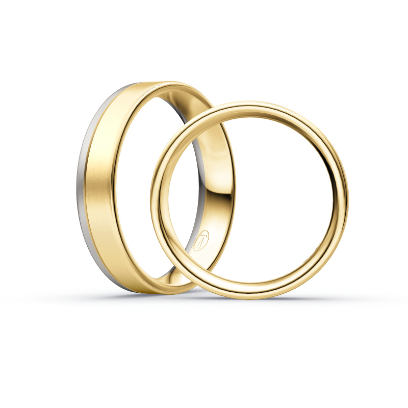 Aufnahme von Trauringen aus Palladium 500&Gelbgold mit Diamanten in viereckiger Fassung 