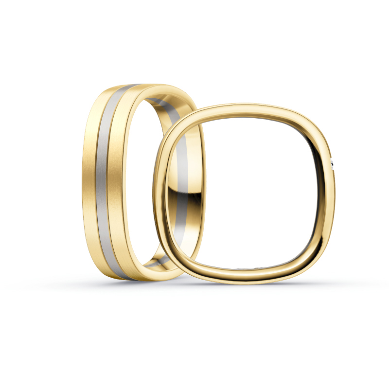 Aufnahme von eckigen Eheringen aus Gelbgold & Palladium 500 bicolor mit drei seitlichen Diamanten 