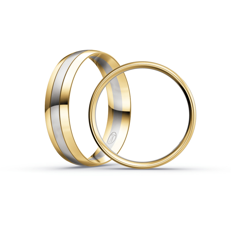 Aufnahme von Trauringen aus Palladium 500 & Gelbgold bicolor mit drei runden Diamanten 