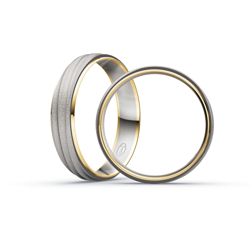 Aufnahme von Eheringen aus Palladium 500/Gelbgold sandmatt mit fünf weißen Diamanten 
