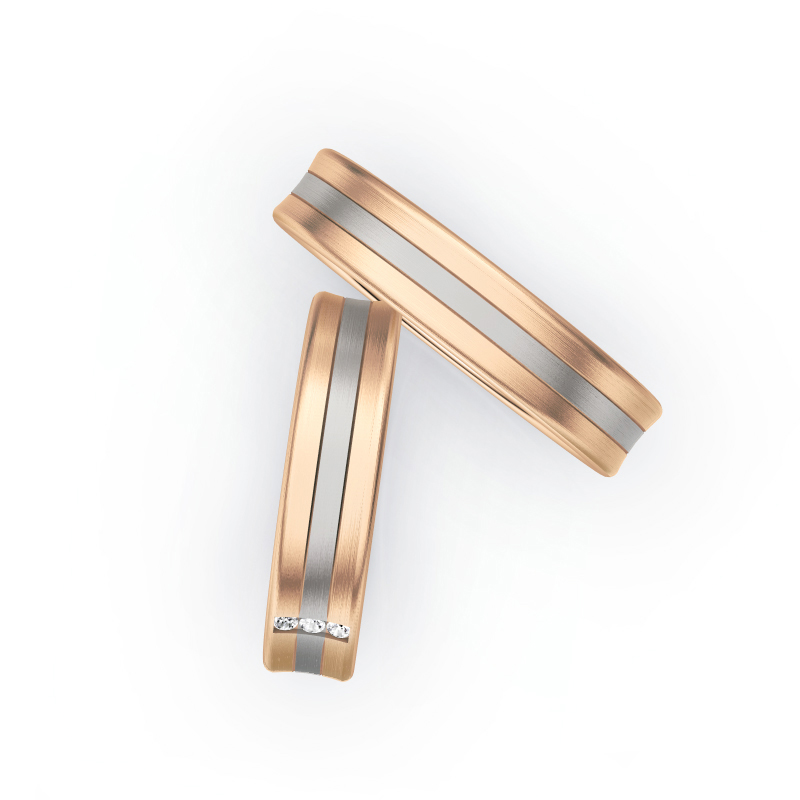 Aufnahme von Trauringen aus Palladium 500&Rosègold matt mit drei mittigen Diamanten 