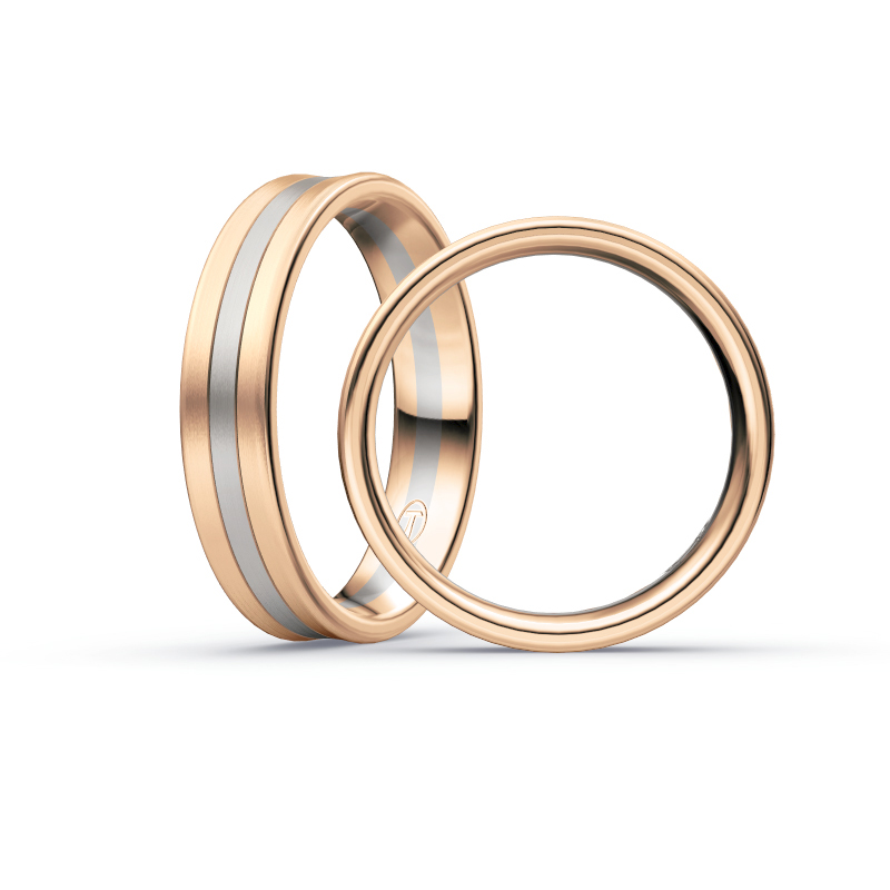 Aufnahme von Trauringen aus Palladium 500&Rosègold matt mit drei mittigen Diamanten 