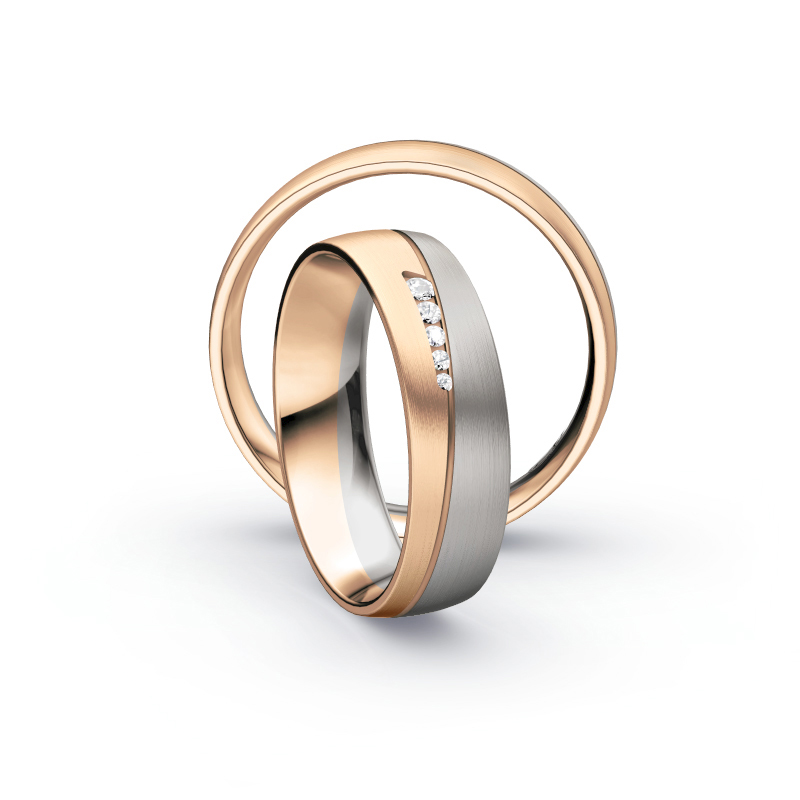Aufnahme von Eheringen aus Palladium 500 und Rosègold längsmattiert mit fünf weißen Diamanten 