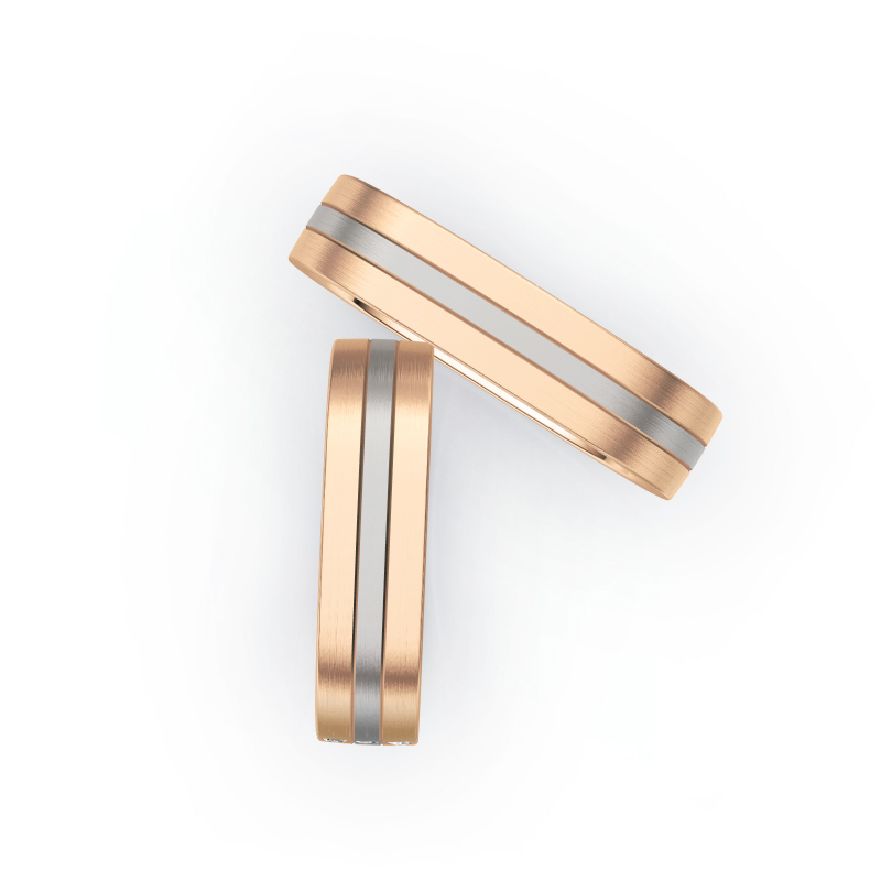 Aufnahme von Trauringen aus Rosègold/Palladium 500 mit seitlich gesetzten weißen Diamanten 