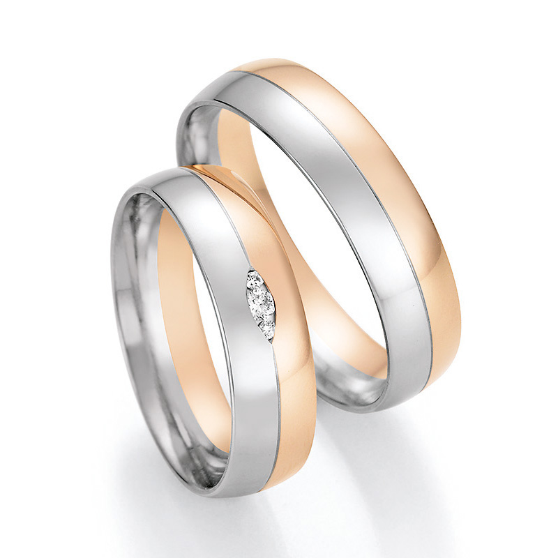 Aufnahme von Trauringen aus Palladium 500/Roségold hochpoliert mit 3 Diamanten