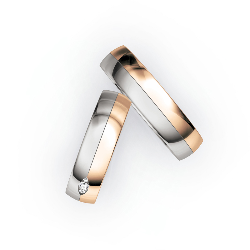 Aufnahme von Trauringen aus Palladium 500/Roségold hochpoliert mit 3 Diamanten