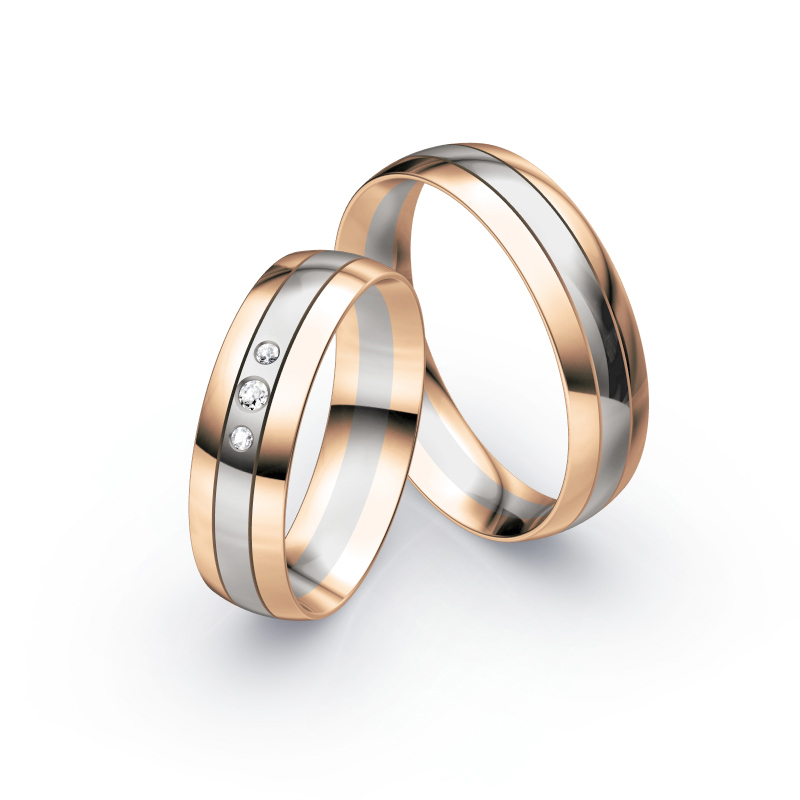 Aufnahme von Eheringen aus Palladium 500 & Roségold mit 3 mittig gesetzten Diamanten 
