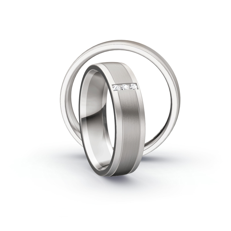 Aufnahme von Eheringen in Palladium 500&Weißgold mit drei runden Diamanten 