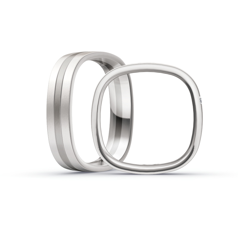 Aufnahme von Trauringen in Weißgold&Palladium 500 mit längsmattierter Oberfläche und Diamanten 