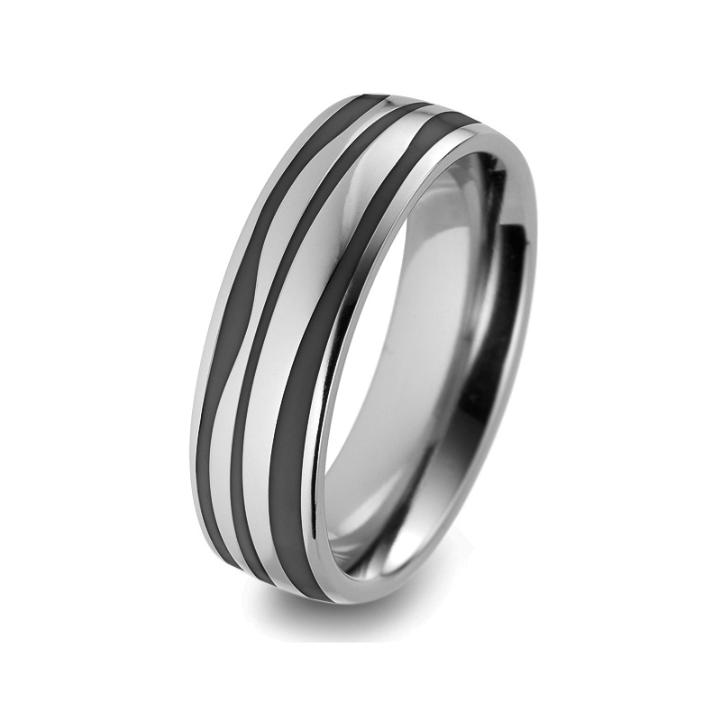 Aufnahme von Trauringen aus Titan und Keramik mit schwarz-weißen Wellen und 3 Diamanten