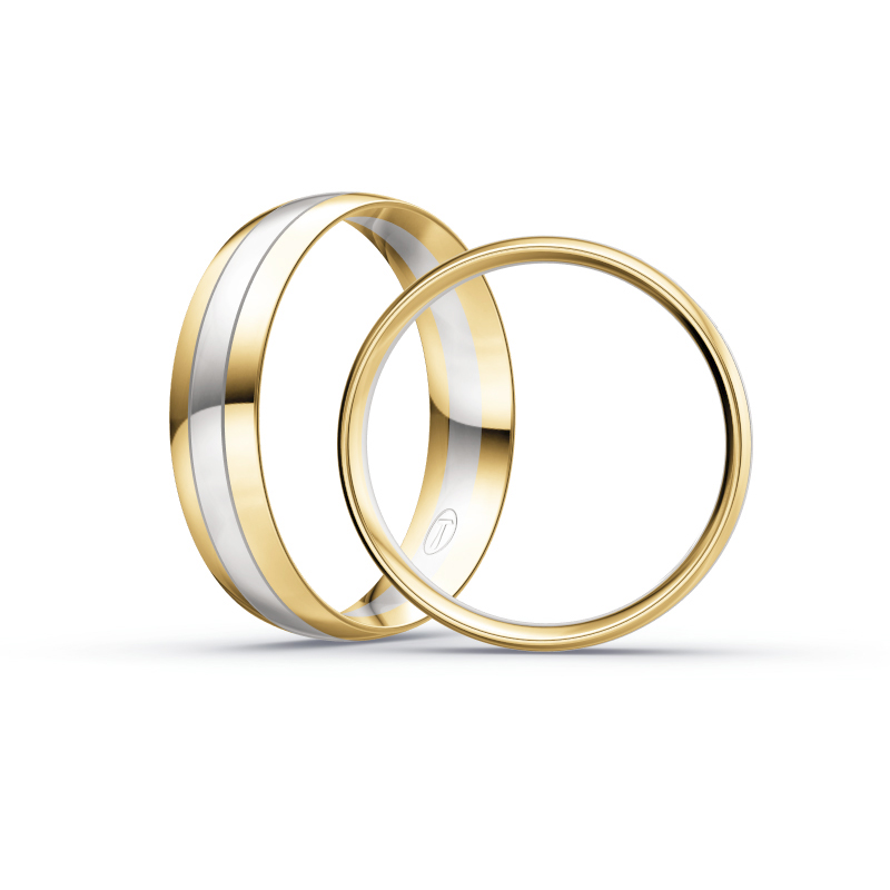 Aufnahme von Trauringen aus Weißgold mit Gelbgoldrändern und mittigen Diamanten