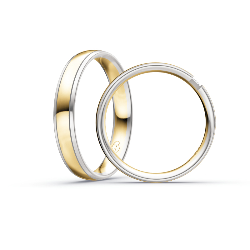 Aufnahme von Eheringen aus Weißgold und Gelbgold mit rundem Diamanten 
