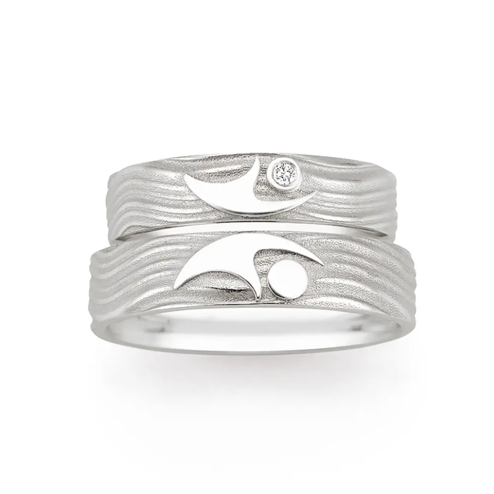 Eheringe aus 925er Silber mit ringübergreifendem Paarfigur-Symbol