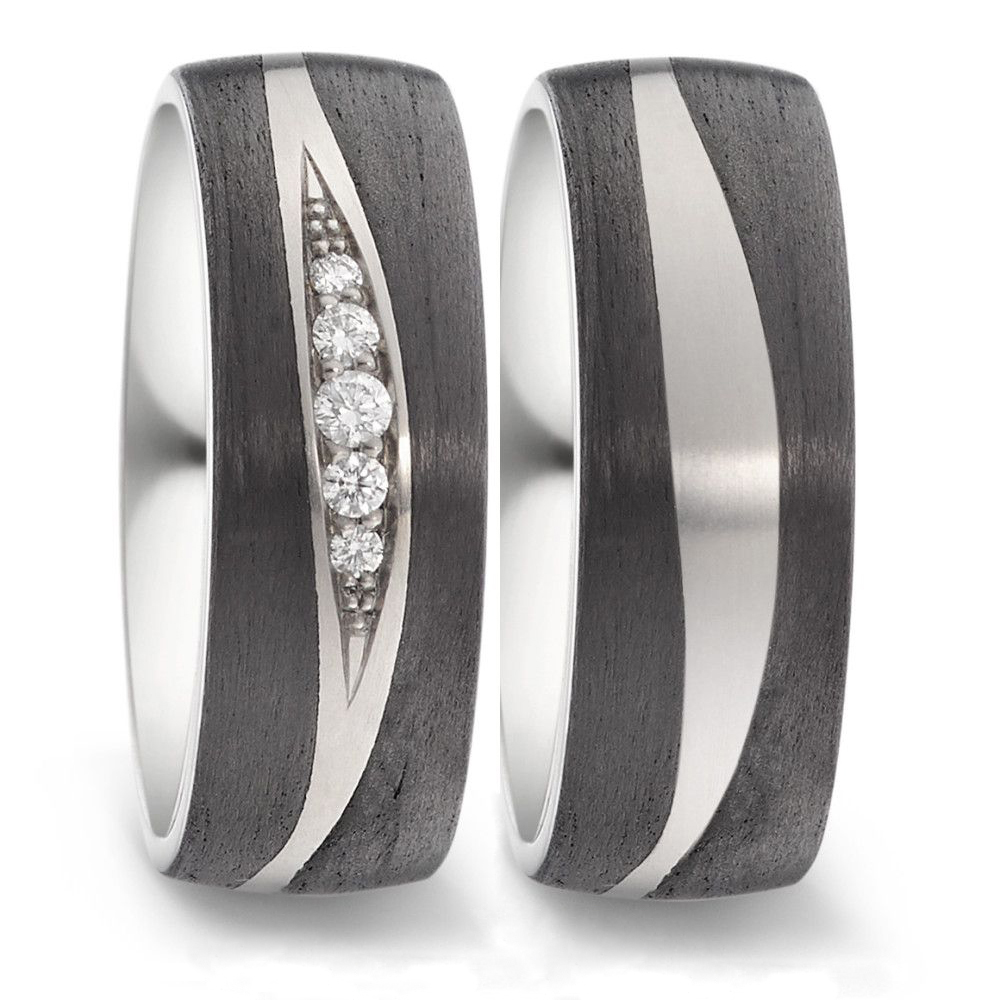 Aufnahme von Carbon & Titan Trauringen mit mehreren Diamanten