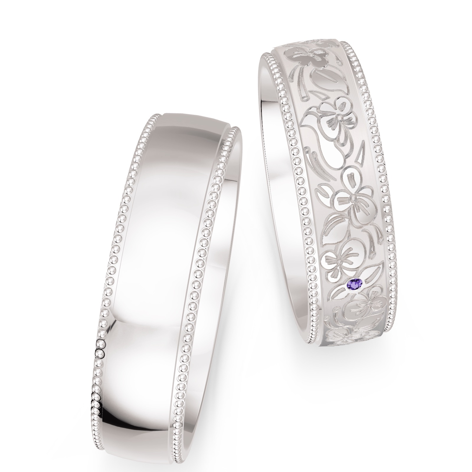 Weißgold Trauringe in Millgriff-Optik verziert mit floralem Muster und violettem Diamanten 
