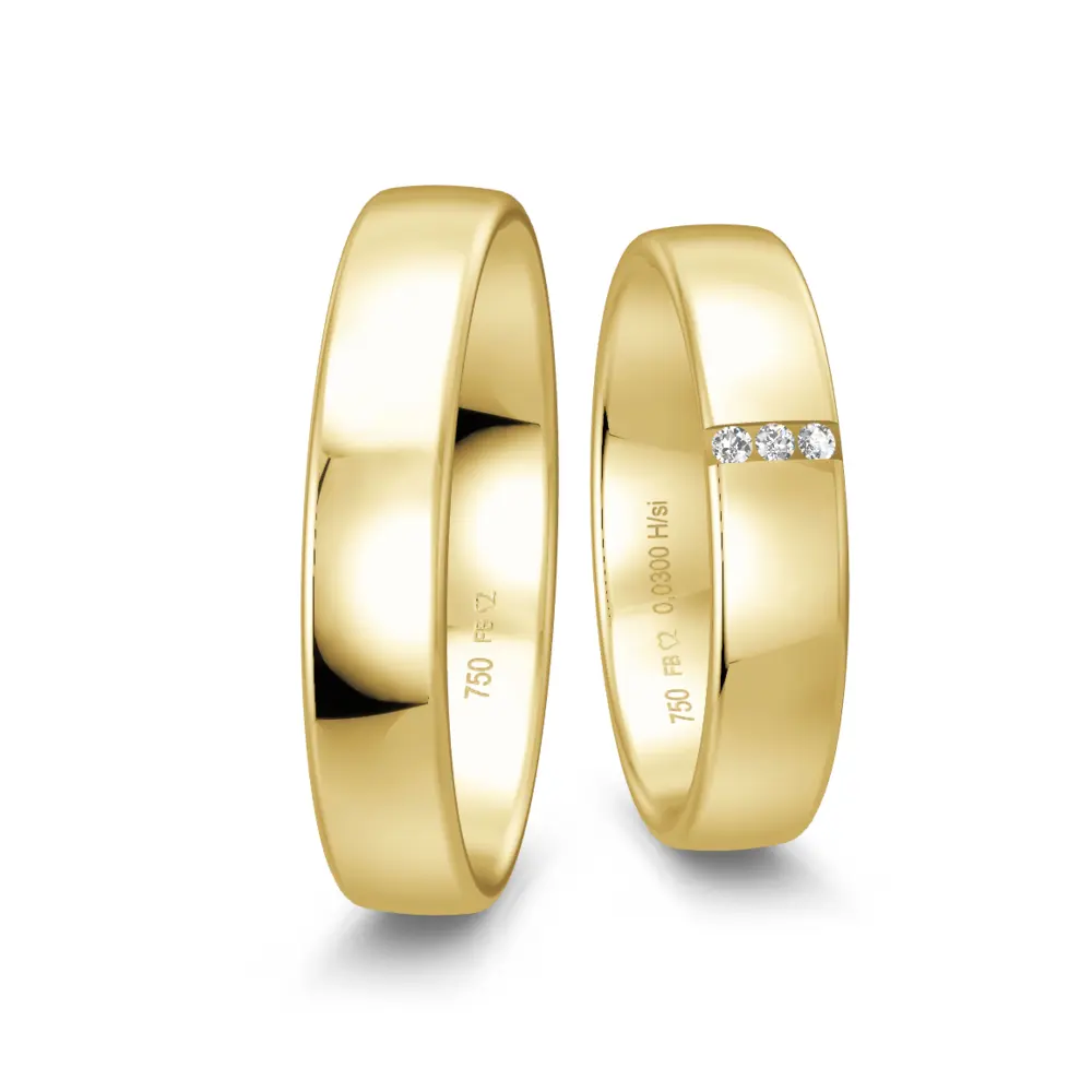 Mit Polierung gestaltete Gelbgold Eheringe mit drei Diamanten