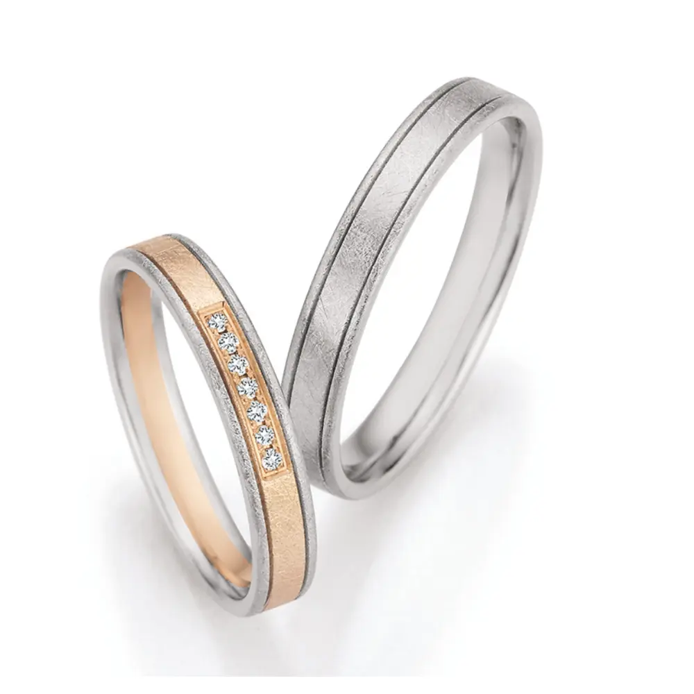 Eismattierte Palladium 500 und Champagne Gold Eheringe mit 7 Diamanten