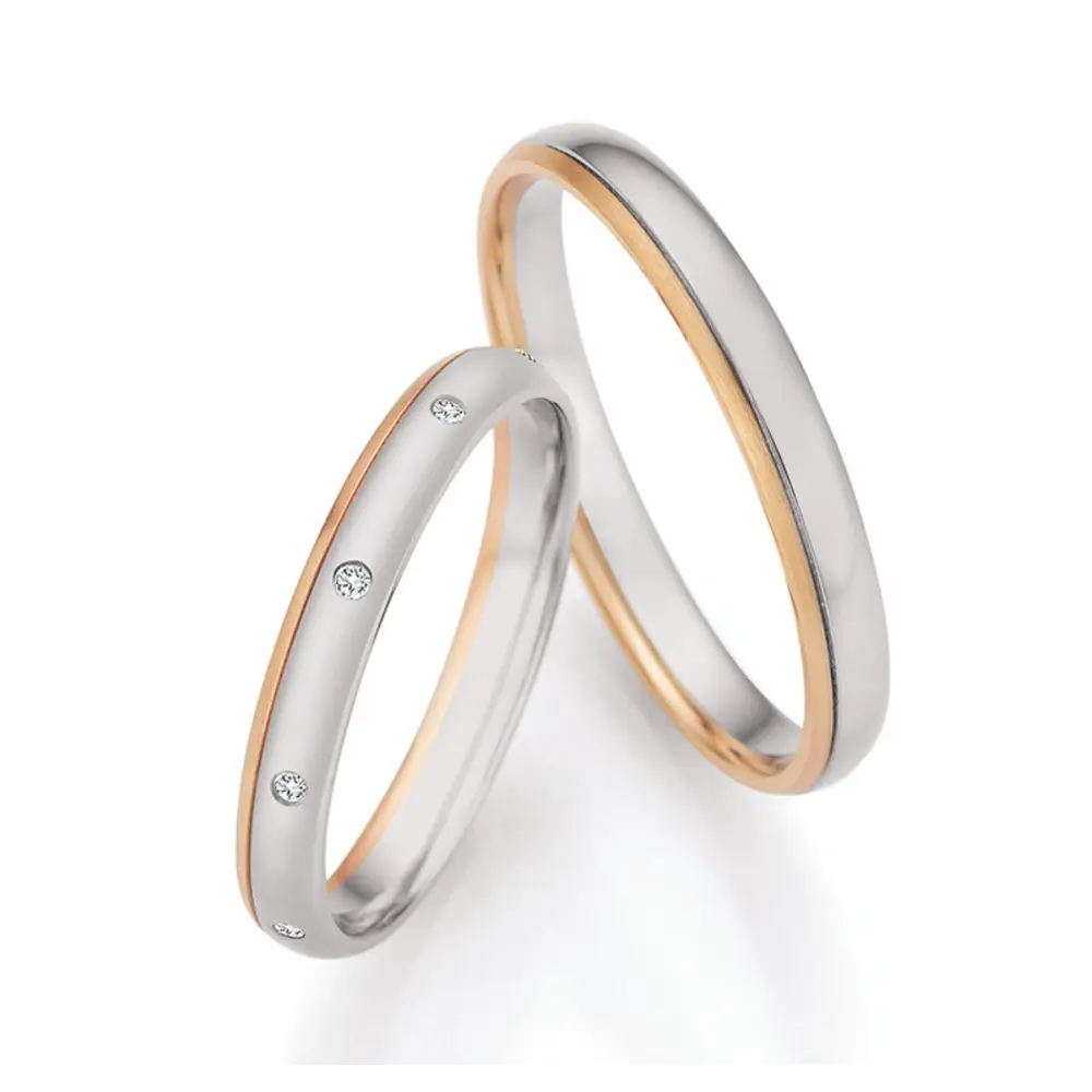 Palladium 500 und Champagne Gold Eheringe mit 9 Diamanten mattiert