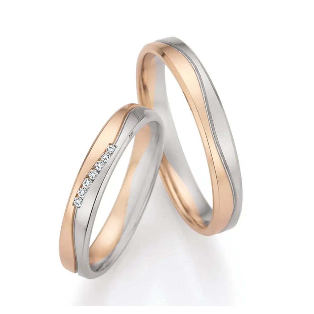 Polierte Palladium 500 und Champagne Gold Eheringe mit 7 Diamanten