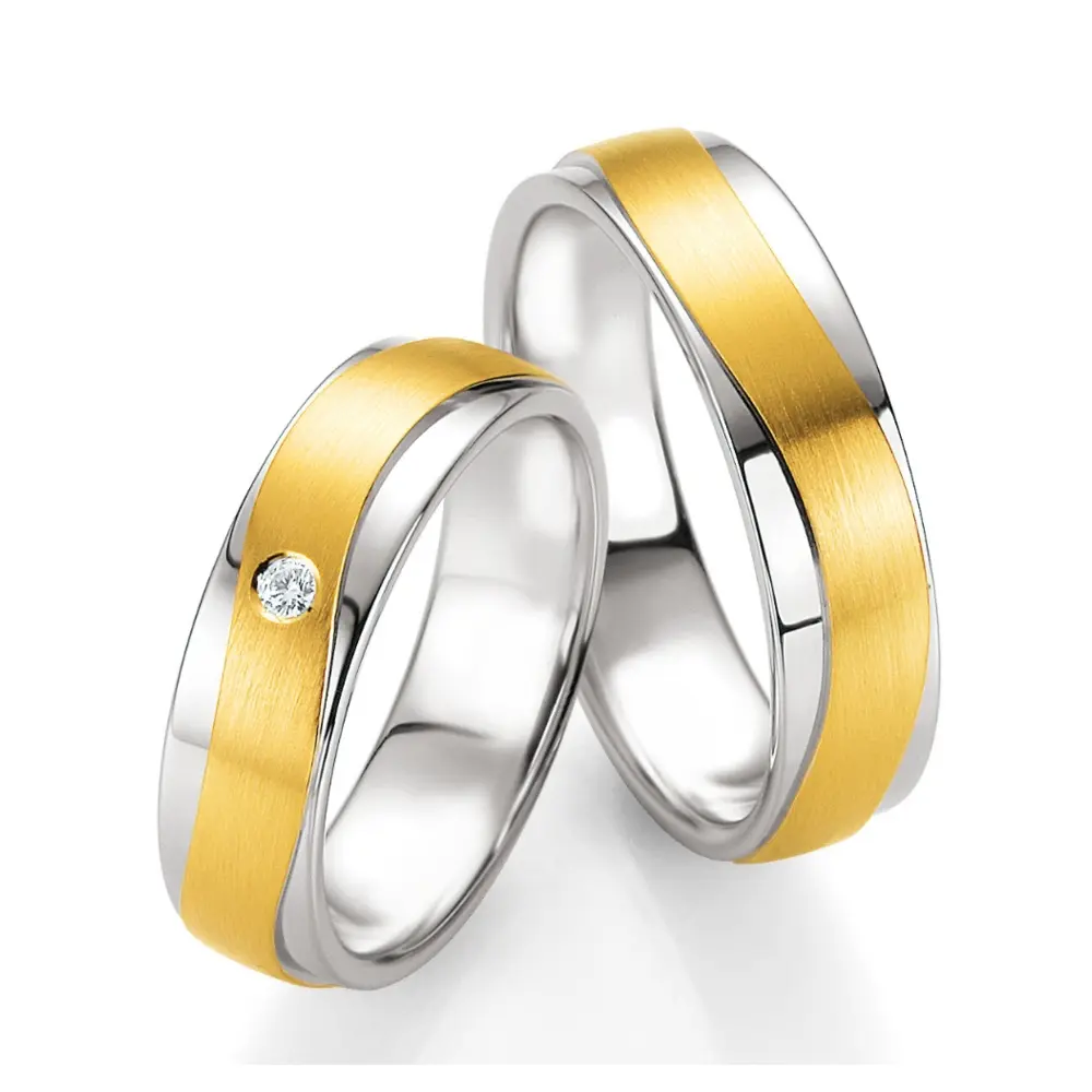 Trauringe aus Silber 925 mit 3 Diamanten und 585er Gelbgold als sandmattes Band