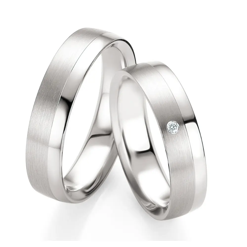 Trauringe aus poliertem Silber 925 mit Diamanten und mattem 585er Weißgold