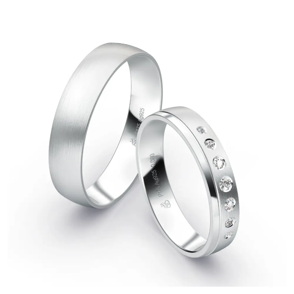 Plagentum Eheringe mit flacher Form und 7 Diamanten unterschiedlicher Größe