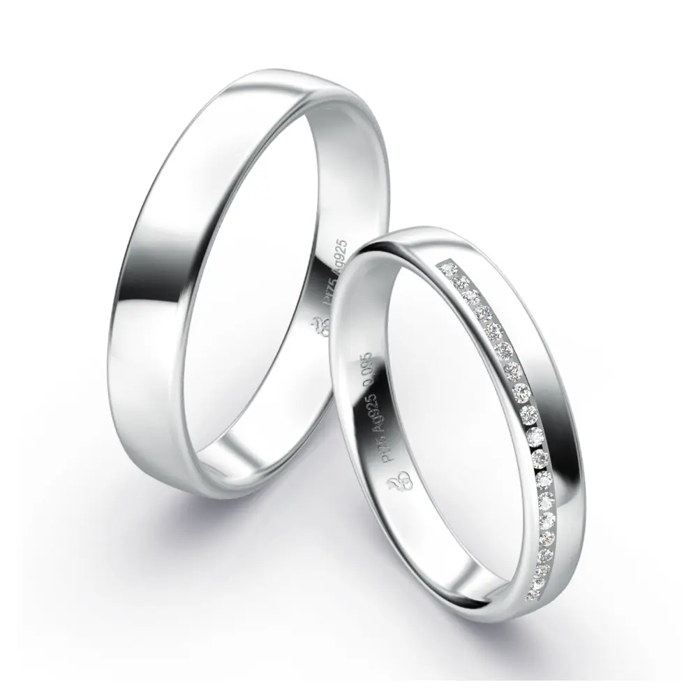 Polierte Eheringe aus Plagentum in zwei Breiten mit einem Diamantenband im Damenring