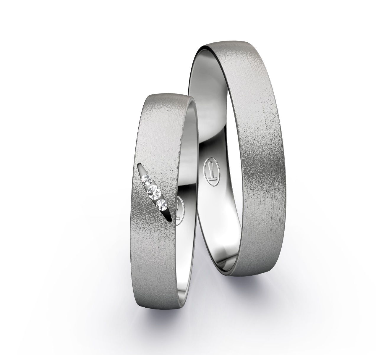 Trauringe aus Platin mit 3 Diamanten und Sandmattierung