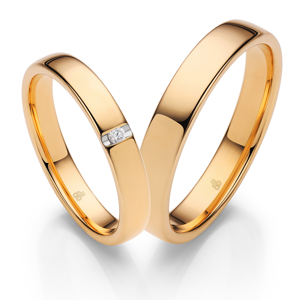 Klassische Eheringe aus poliertem Sommergold und Diamanten
