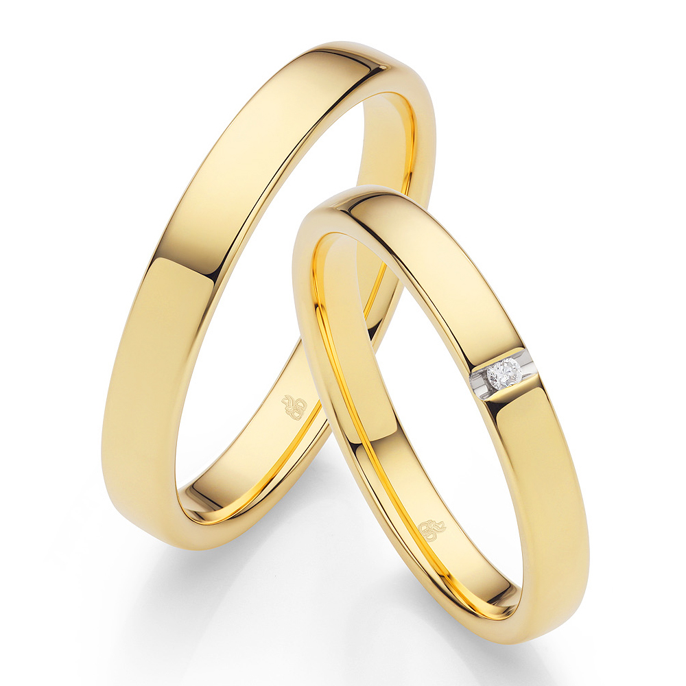 Gelbgold Eheringe mit polierter Oberfläche und Diamant in Spannfassung